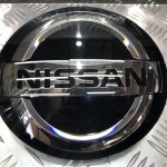 Эмблема передняя под дистроник (круглая) Nissan Rogue X-TRAIL Ниссан Рог  628907FW0A